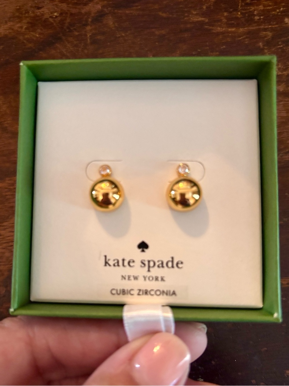 kate spade gold-tone item in lime green box